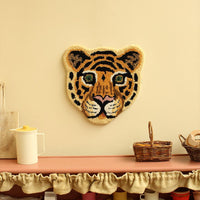 cloudy tiger wool rug by doing goods on wall